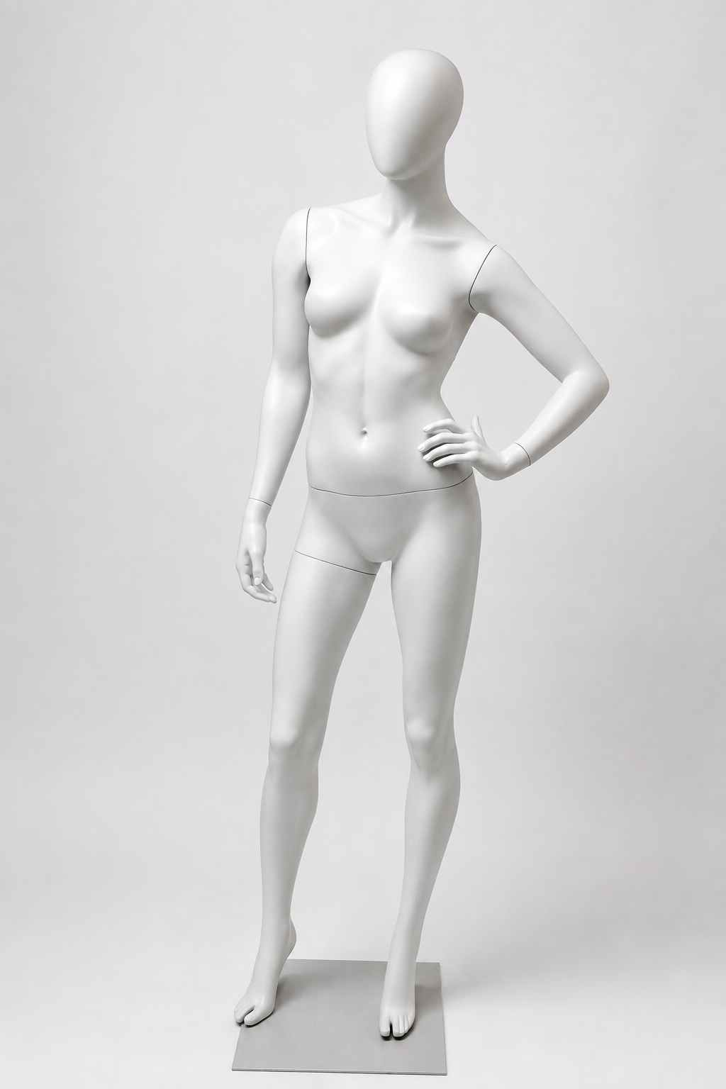 Female mannequin standing with one hand on her hip